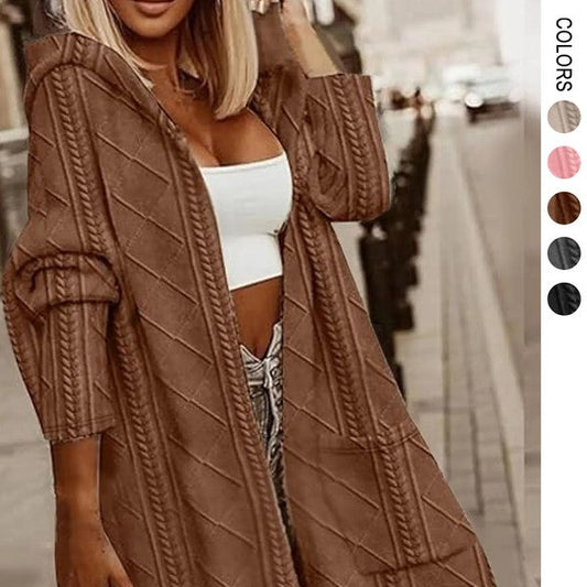 Woman wearing a brown cable knit cardigan with color swatches on the side.